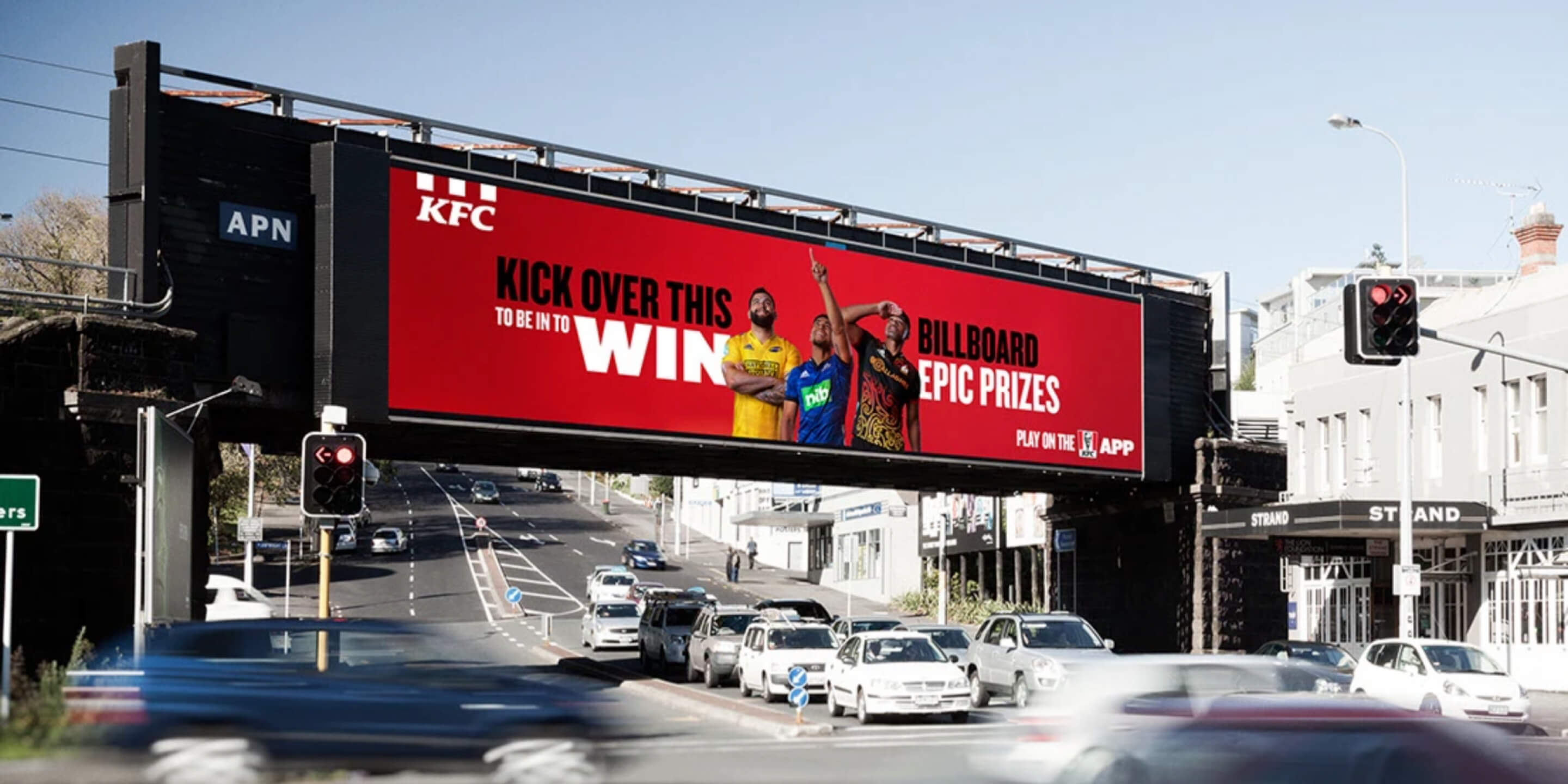 KFC Kicking Game campaign displayed on an outdoor billboard