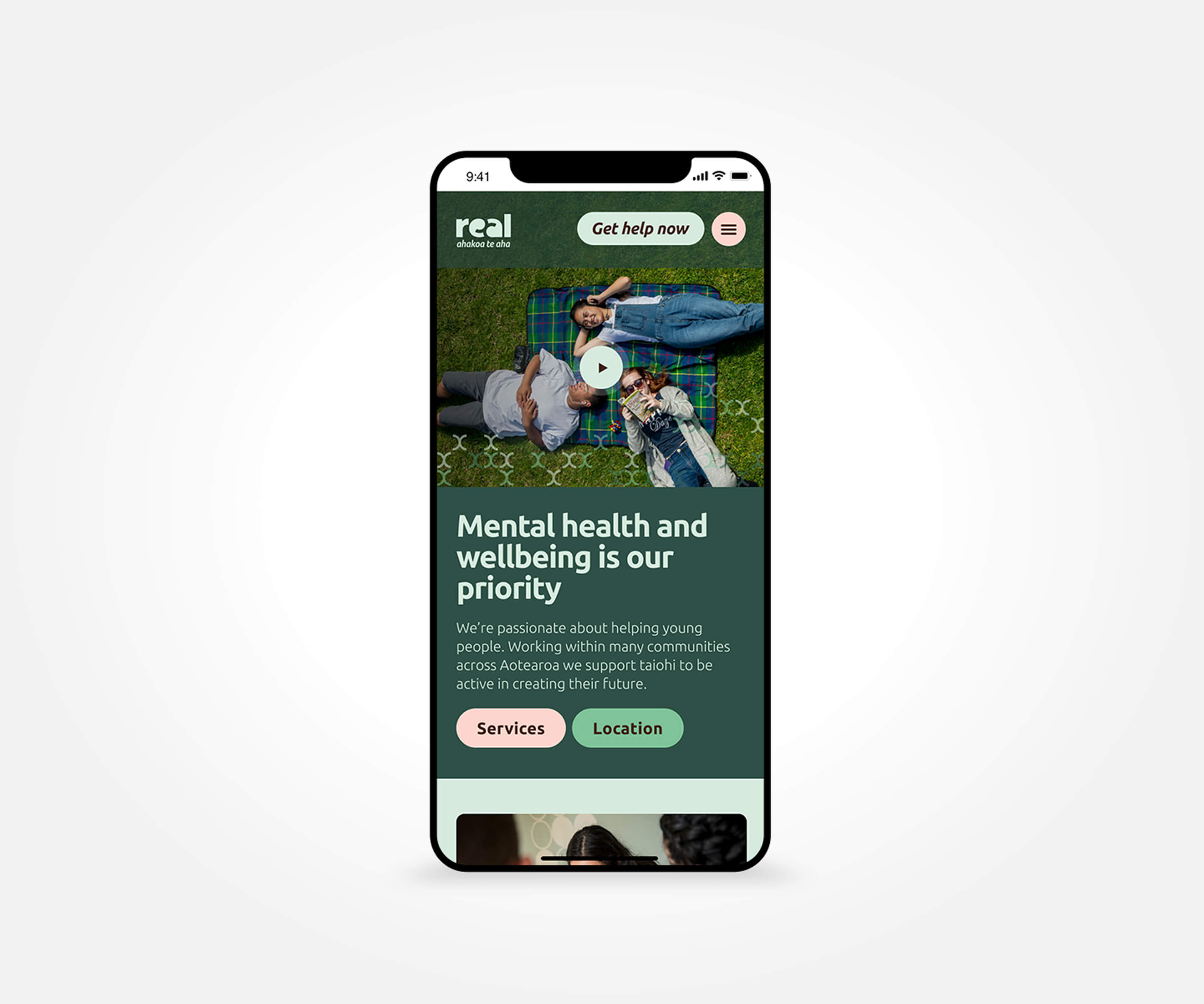 Real youth wellbeing homepage displayed on a mobile phone