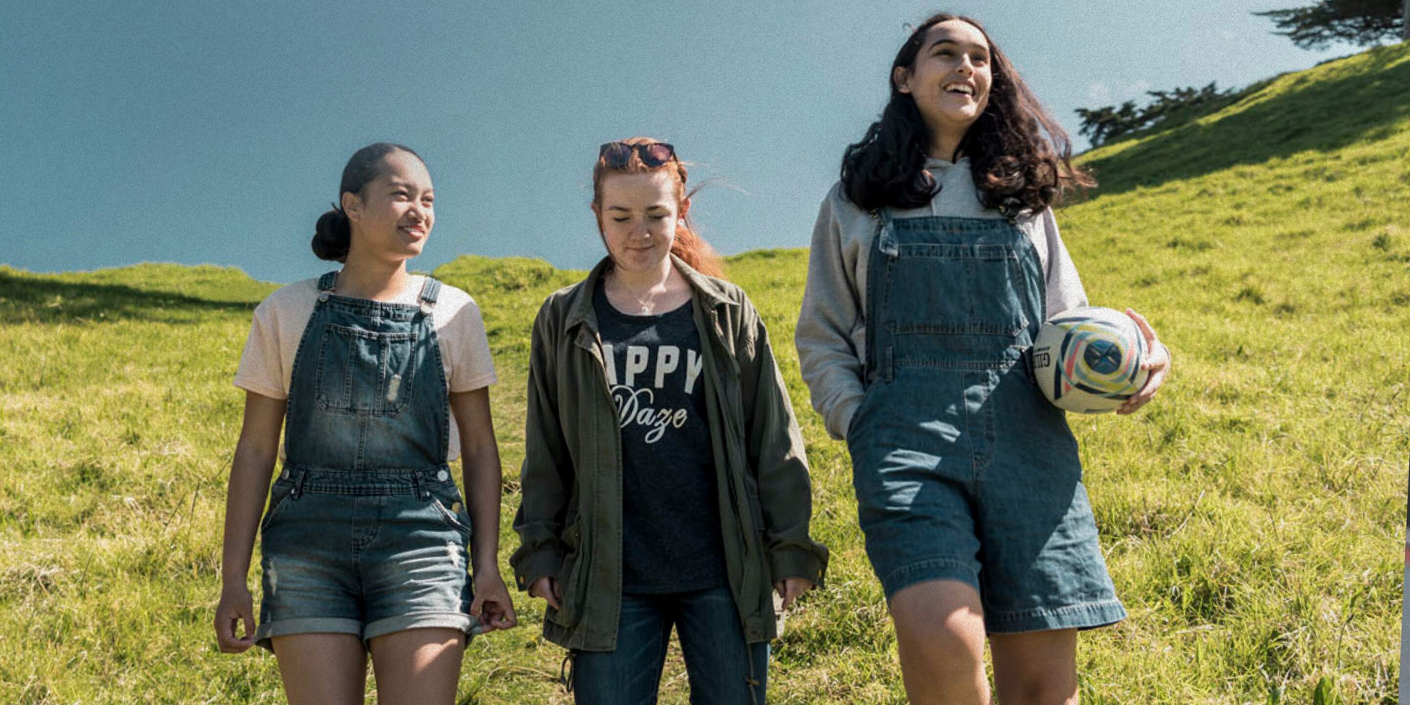 Young people walking together through the hills